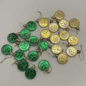 Set of 24 green and gold shamrock coin ornaments for St. Patrick's Day party decor.