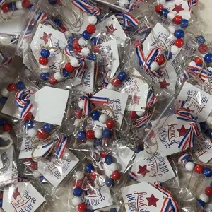 Close-up view of USA Independence Day wood bead garlands with patriotic ribbon details