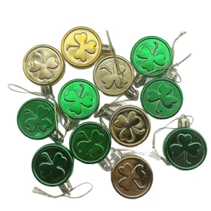 St. Patrick's Day shamrock coin ornaments in gold and green for festive party decor.