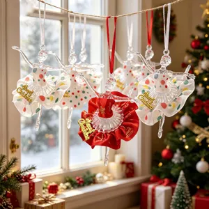Detailed view of hanging acrylic ballet girl Christmas ornaments with gold lettering