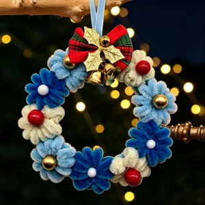 Handmade DIY pipe cleaner Christmas wreath ornament with golden bells and red bow