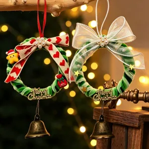 Handmade DIY Christmas pipe cleaner wreaths with bells and bows for holiday decor.