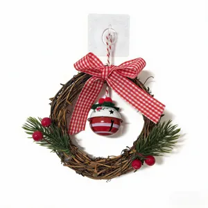 Christmas wreath with red checkered bow and festive bell for door and wall decoration
