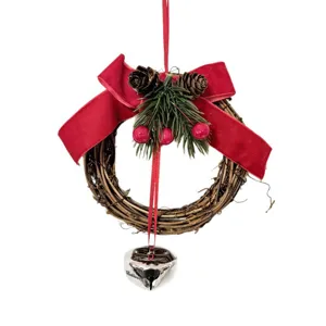 Festive Christmas vine wreath with red velvet bow pine cones and Believe silver bell
