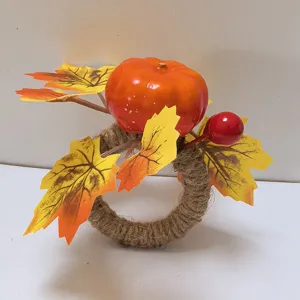 Detail shot of harvest napkin ring with pumpkin and maple leaves decoration