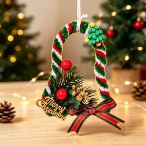 Detail view of handmade Christmas bell ornament with chenille stem and pine needles