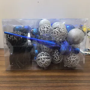 Close-up of Christmas decoration set with blue and silver baubles and LED lights.