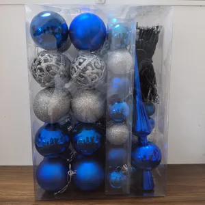 Detail view of blue and silver Christmas ornament set with light string in a clear box