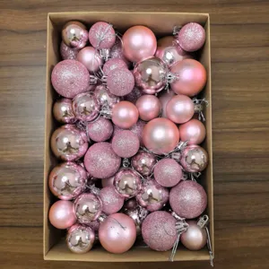 Close-up of 50pcs pink Christmas ornaments set in matte, shiny, and glitter finishes