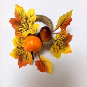 Detailed view of Thanksgiving napkin ring featuring maple leaves and pumpkin decor