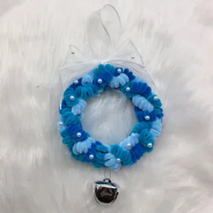 Detail of 14cm blue chenille stem Christmas wreath with pearls and Believe bell.