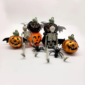 Detailed view of Halloween skeleton, winged pumpkin, and spider party decorations