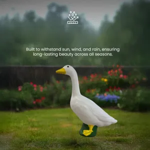 22-inch white goose garden statue displayed in rainy outdoor setting for durability