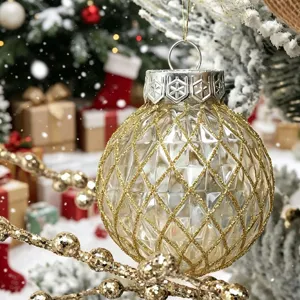 Detailed macro view of a gold glitter geometric Christmas ornament hanging on a tree