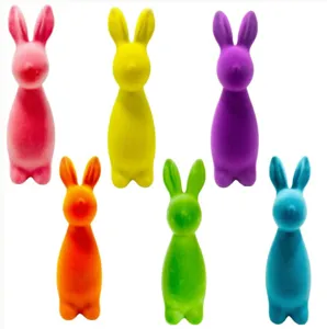 Six colorful flocked Easter bunny figurines in vibrant shades for festive indoor party decor.