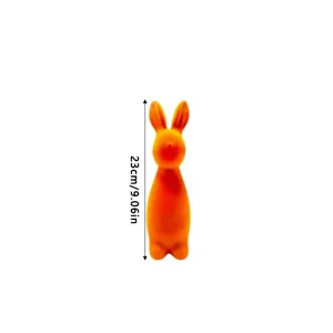 Orange flocked rabbit figurine with height measurement of 23cm or 9.06 inches.