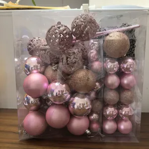 Detailed view of rose gold Christmas ornament set with various textures in a clear box