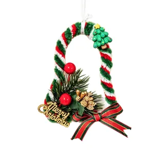 Handmade Christmas bell ornament with twisted stick design and Merry Christmas sign