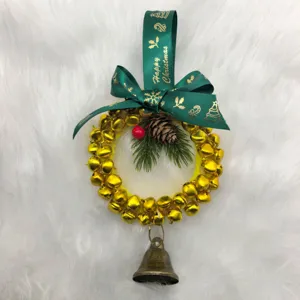 Close-up detail of a festive Christmas bell wreath featuring a green Happy Christmas ribbon bow