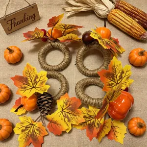 Set of Thanksgiving napkin rings decorated with autumn maple leaves and miniature pumpkins