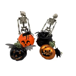 Assorted Halloween party decorations set with skeletons, spiders, and pumpkin buckets
