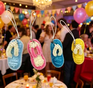 Detailed view of handmade pipe cleaner flip-flop keychains at a festive party event.
