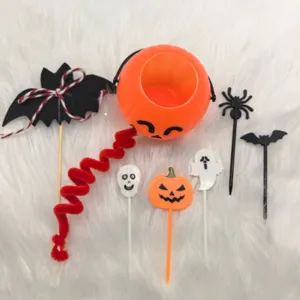 Festive Halloween cake toppers set featuring pumpkin bucket, bat, ghost, and skull motifs