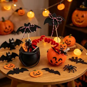Halloween party table setup with witch cauldrons, pumpkin buckets and bat toppers