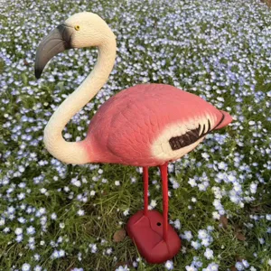 Realistic pink plastic flamingo statue for outdoor garden, yard and lawn decoration.