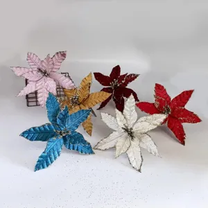 Detail of assorted glitter artificial poinsettia flowers for Christmas decoration