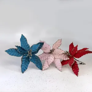 Set of three glitter artificial Christmas poinsettia flowers in blue, pink, and red