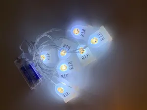 Close-up of Halloween tombstone LED string lights with RIP text and skull