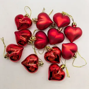 Macro view of 12PCS red heart-shaped hanging ornaments with shiny and matte finishes