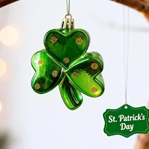 Detailed view of a green St. Patrick's Day shamrock clover ornament with gold glitter.