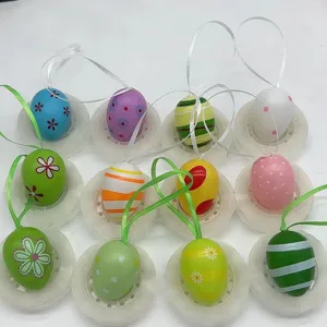 Collection of colorful hand-painted plastic Easter eggs with ribbons for hanging decor