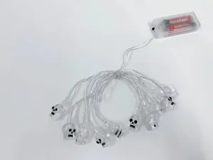 Close-up detail of Halloween LED skull string lights with clear battery box included