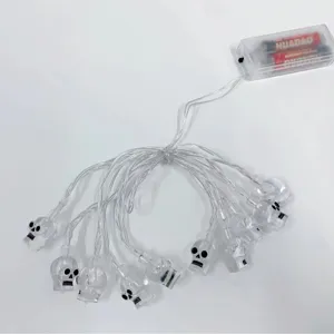 Halloween LED string lights featuring transparent skull decorations with battery box