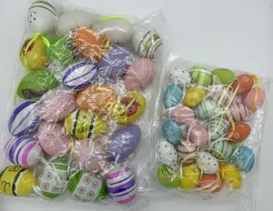 Detail view of bulk packaged colorful patterned plastic Easter eggs with hanging ribbons