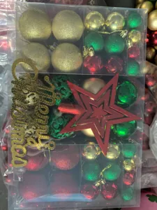Close-up of 102-piece Christmas ornament set with balls and star topper in box