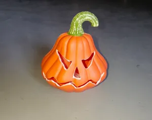 Macro view of a classic orange Halloween Jack-o'-lantern plastic lamp for festive decor