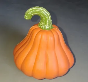 Detailed macro view of an orange plastic pumpkin lantern for Halloween decorations