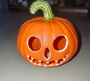 Detailed view of an orange plastic Halloween Jack-o'-lantern lamp with a green stem