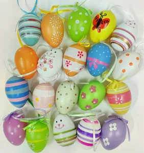 Assorted colorful painted plastic Easter eggs with hanging ribbons for party decor