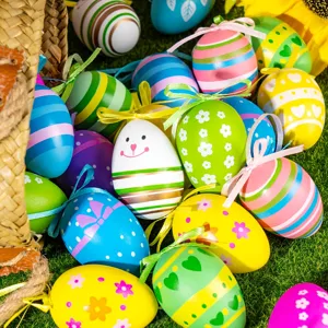 Detailed view of colorful painted plastic Easter eggs with hanging ribbons and bows