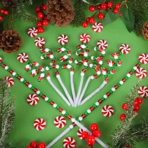 Detailed red and white peppermint candy Christmas picks arranged on a green background.