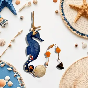 Close-up of a blue Mediterranean seahorse wind chime with sea shells and bell