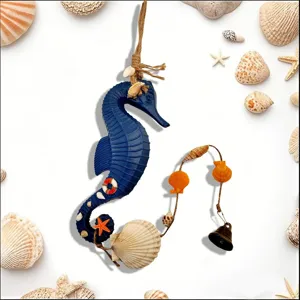 Macro view of a Mediterranean blue seahorse wind chime featuring shells and metal bell