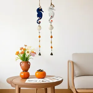 Nautical Mediterranean seahorse wind chimes with seashells hanging in a cozy living room