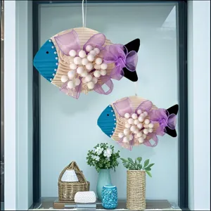 Mediterranean style hanging fish decorations with purple bows for home party wall decor.