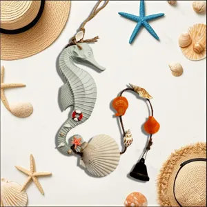Detailed view of Mediterranean seahorse wind chime with shells and a small bell